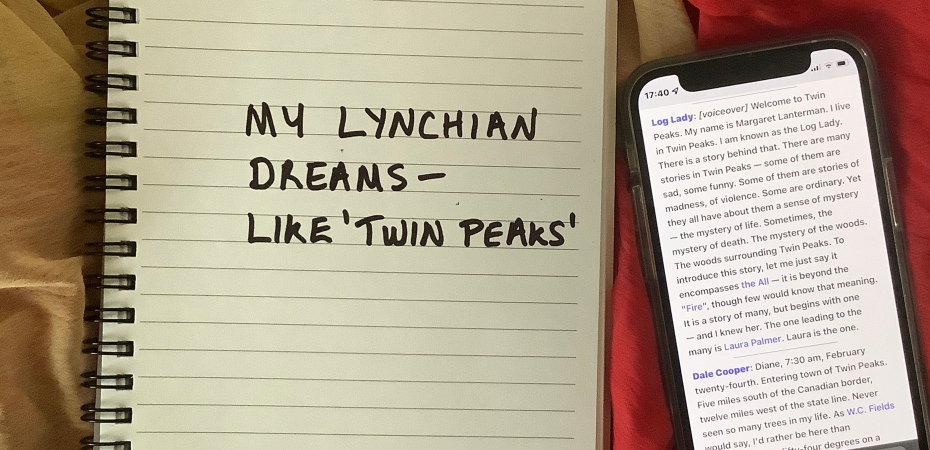 Twin Peaks quote from Wikipedia on a smartphone beside a spiral diary with handwritten text.